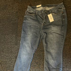 Hand sanding brand new Judy blue size 18 w jeans with tags